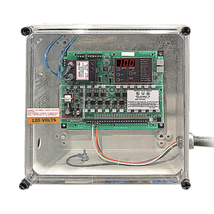 A clear plastic electrical enclosure, ideal for dust collectors, displays a circuit board with a digital “100” display, various components, wires, and a “120 VOLTS” warning label inside. The enclosure is mounted on a white background.