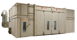 Large industrial Blast Booth Enclosure with white panels and a ventilation duct on the left side. The booth features two large front doors, small windows, and Kresco logos above the entrance.